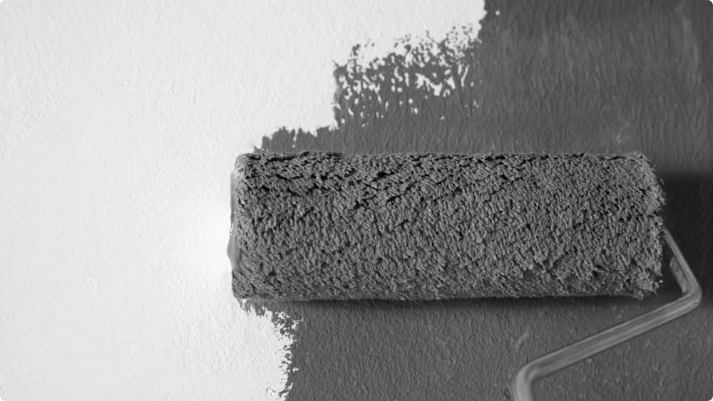 Applicatie van een coating op een muur